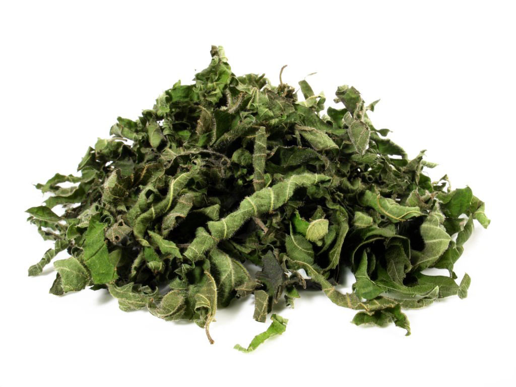 dried stinging nettle tea on white background healthy nutrition